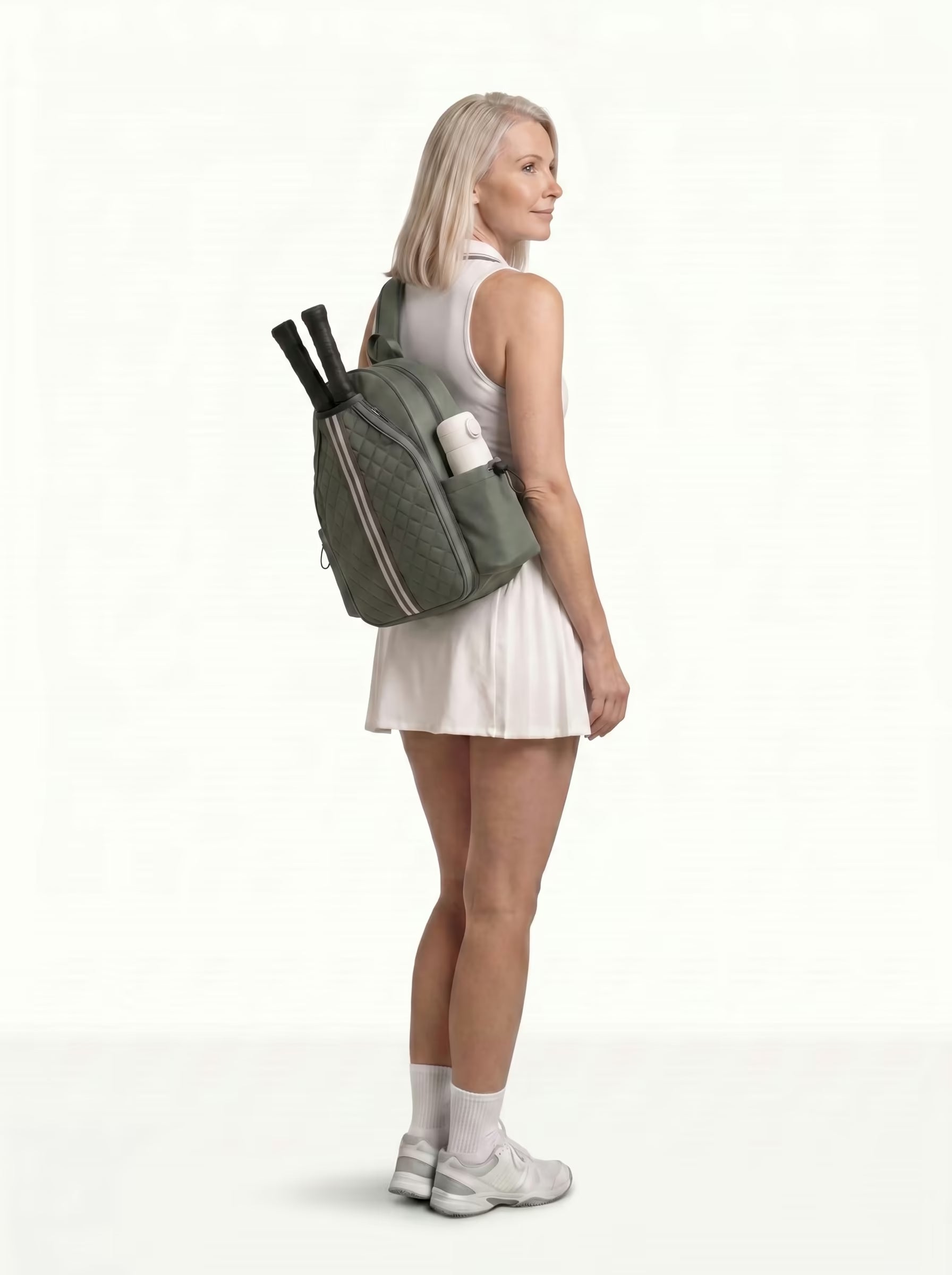 Woman wearing Green Rally Cross Body Backpack on the way to play pickleball