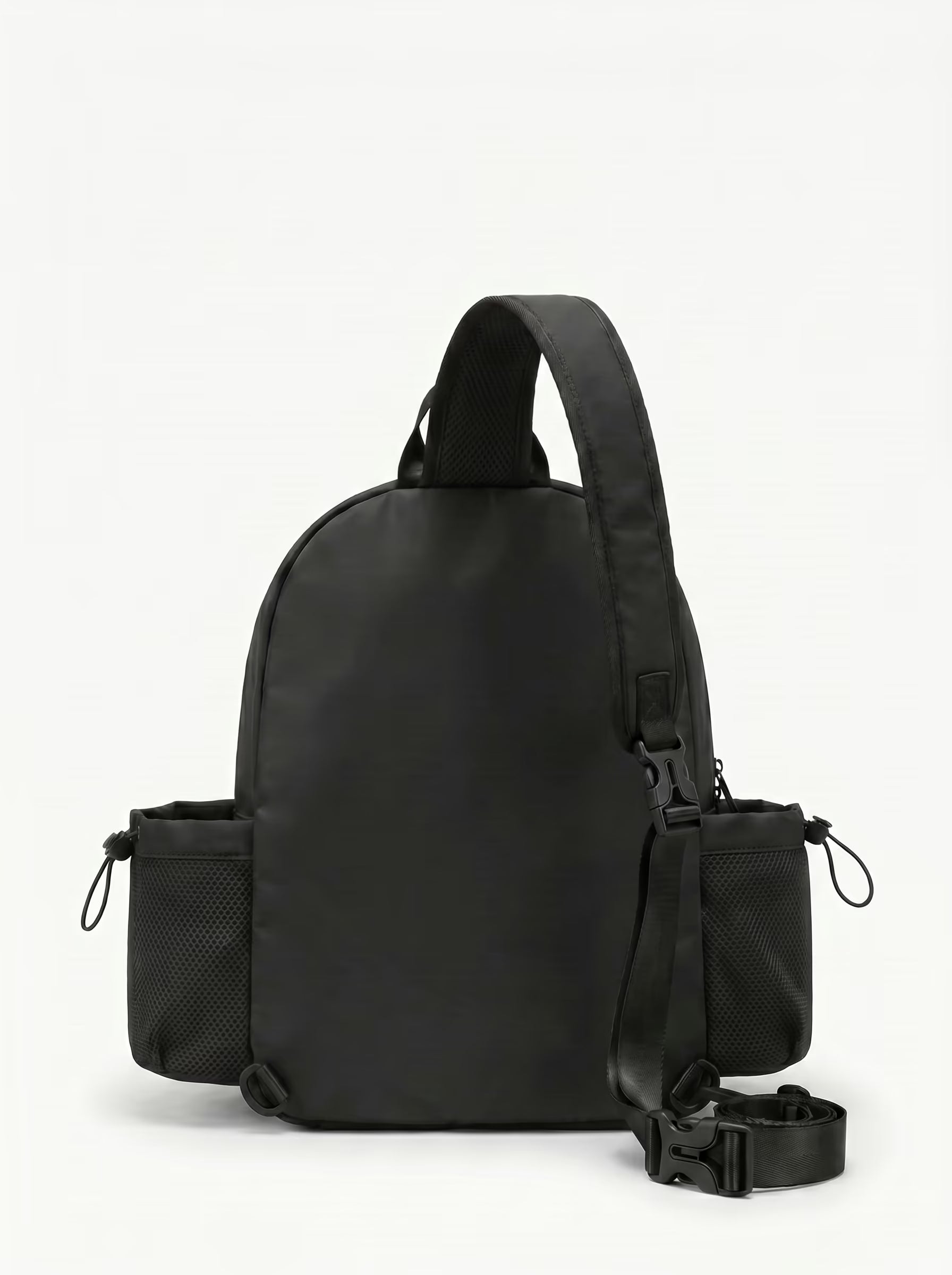 Back view of Black Rally Cross Body Backpack showing crossbody strap and padded paddle sleeve
