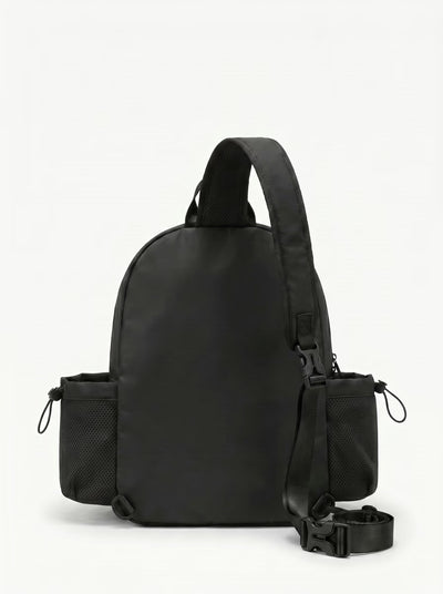 Back view of Black Rally Cross Body Backpack showing crossbody strap and padded paddle sleeve