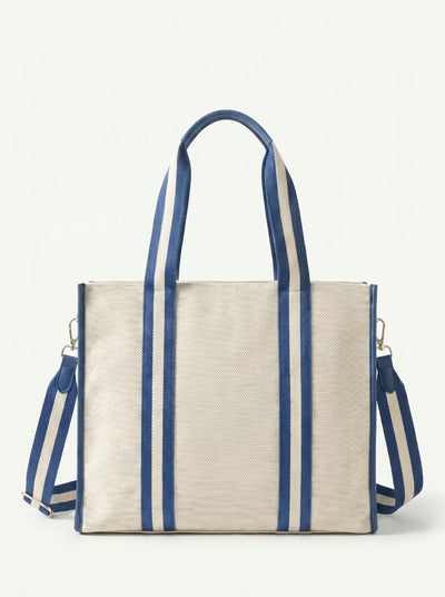 Back view of Blue Rally All Day Tote showing crossbody strap and padded paddle sleeve