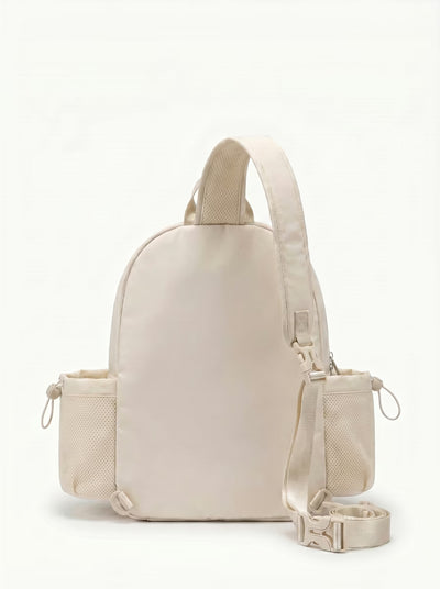 Back view of Beige Rally Cross Body Backpack showing crossbody strap and padded paddle sleeve
