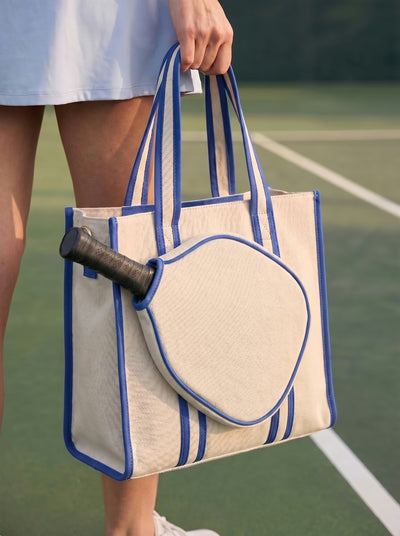 Lifestyle shot of Rally All Day Tote in Blue with pickleball gear