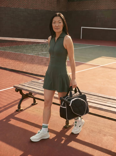 Lifestyle shot of Rally All Day Duffle in Black with pickleball gear