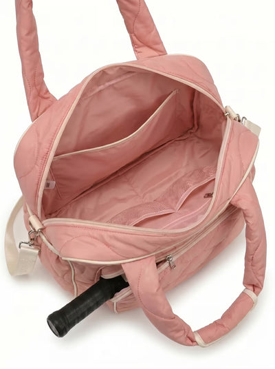 Lifestyle shot of Rally All Day Duffle in Pink with pickleball gear
