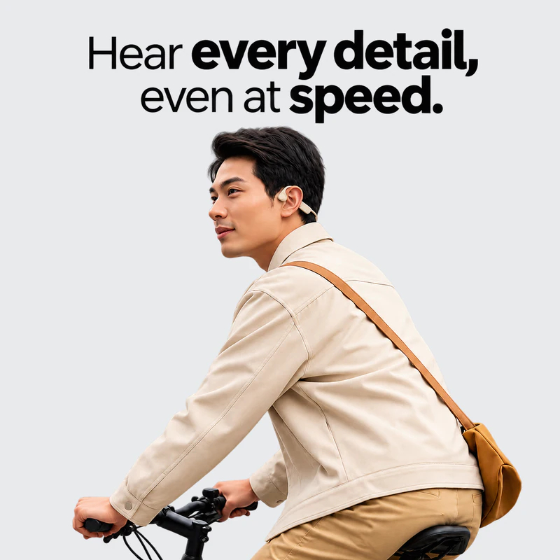 Hear every detail, even at speed. A commuter riding a bike with Rally Audio